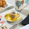 Image of EGAN - GIRAMONDO SET 2 TAZZE CAFFE' CON PIATTO GIALLO IN SCATOLA DI LATTA